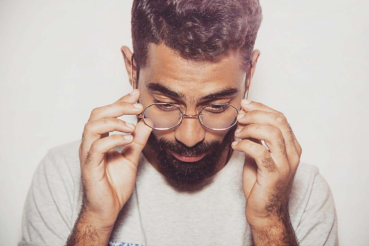 people man about to hold eyeglasses person