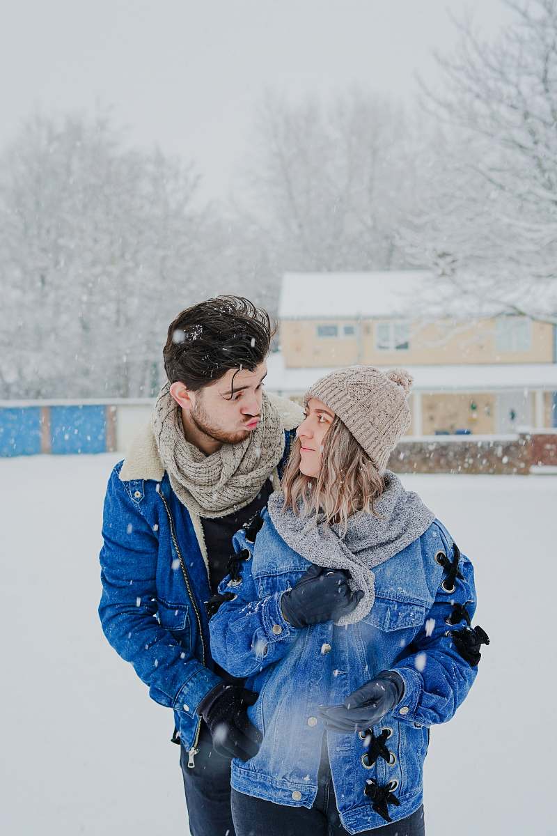people man and woman standing outside during winter person