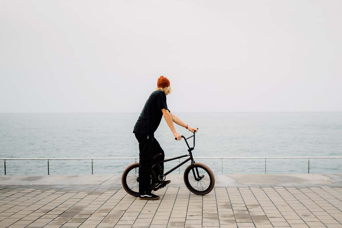 people man holding BMX bike person
