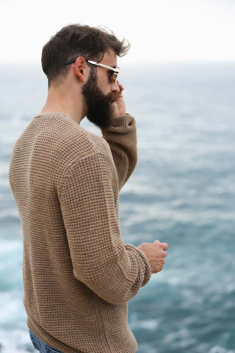 people man holding his sunglasses person