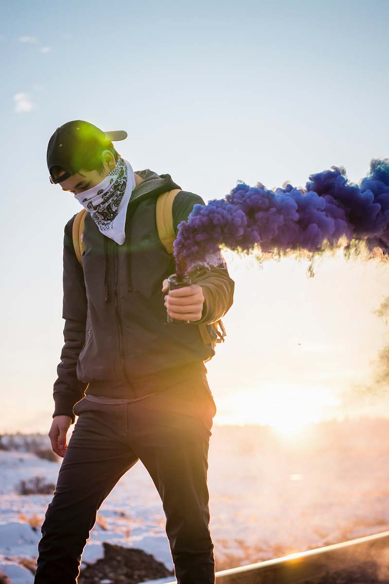 people man holding purple flare person