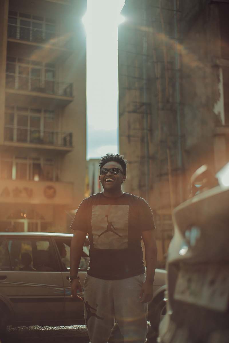 person man in black Air Jordan shirt laughing people