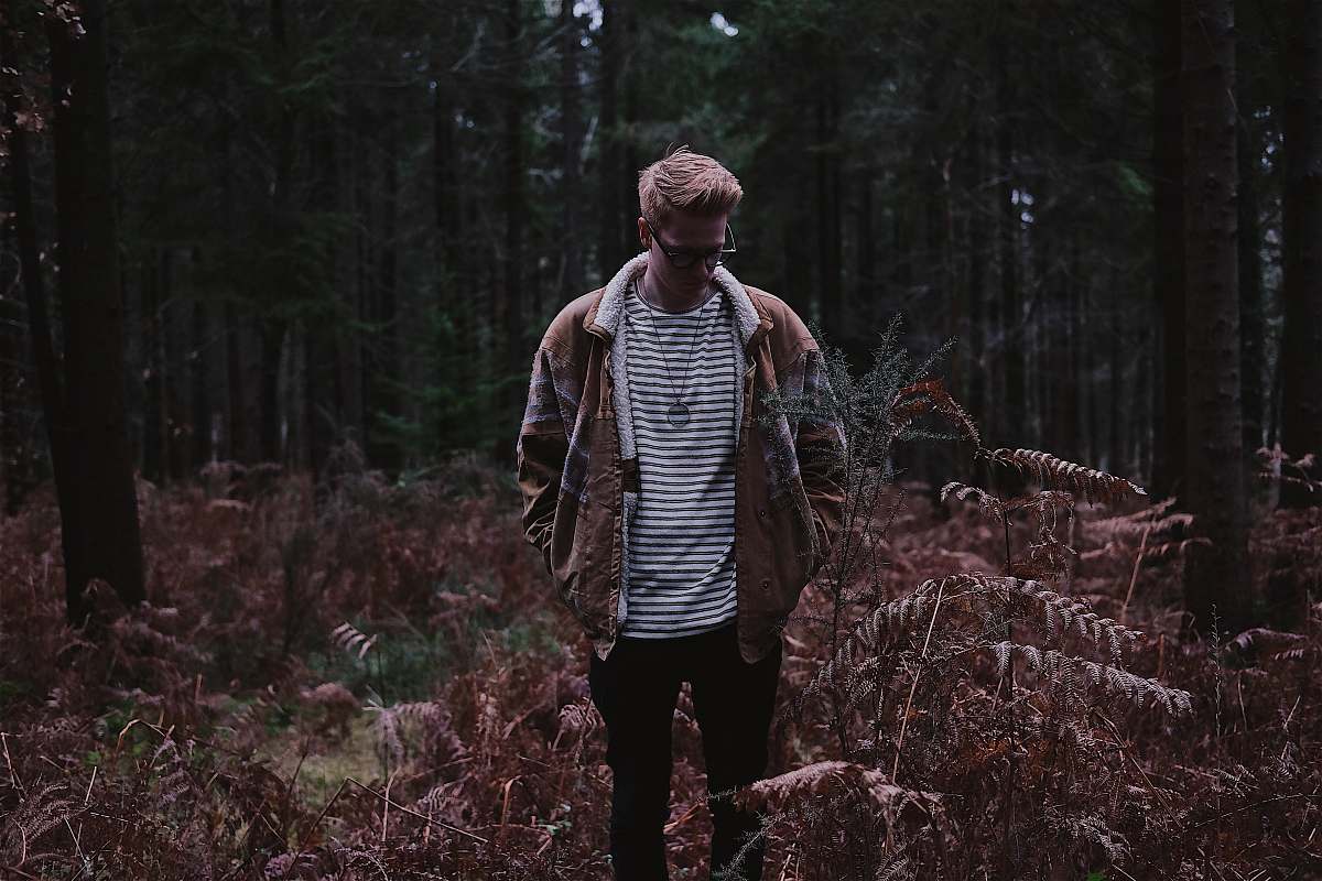 people man in brown jacket during daytime person