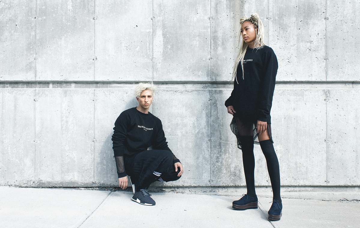 people man kneeling and woman standing near wall person
