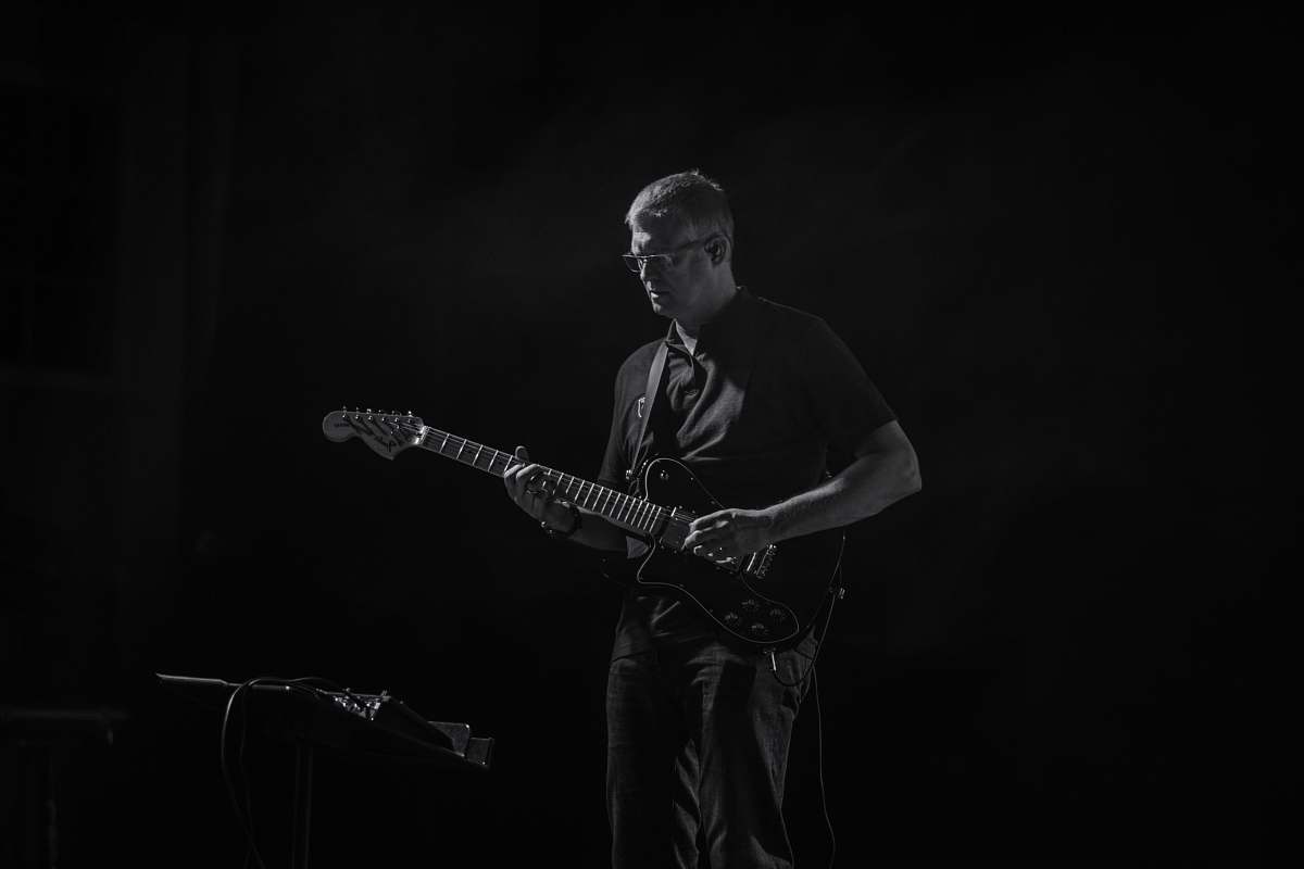 people man playing guitar black-and-white