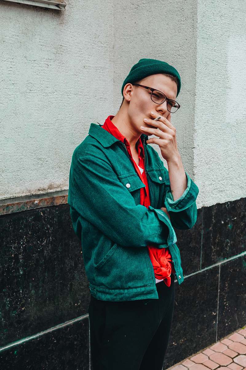 people man smoking cigarette during daytime person