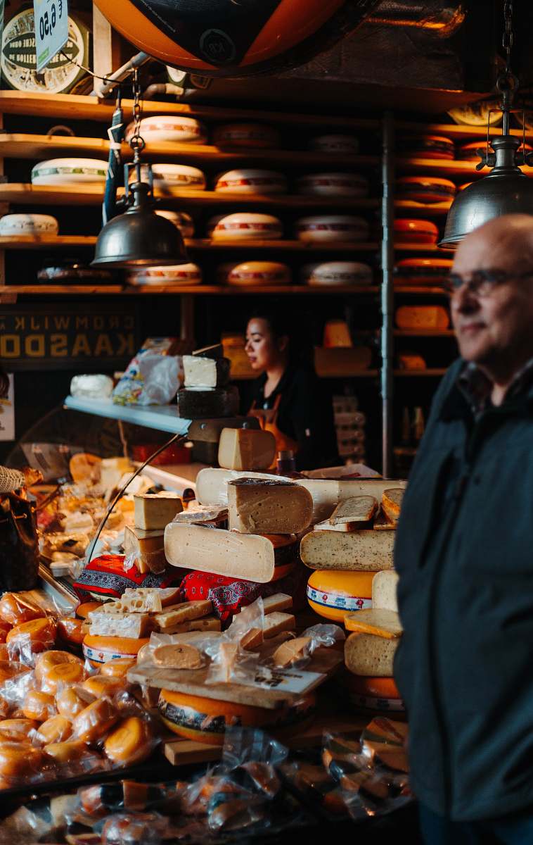 people man standing beside bread packs person