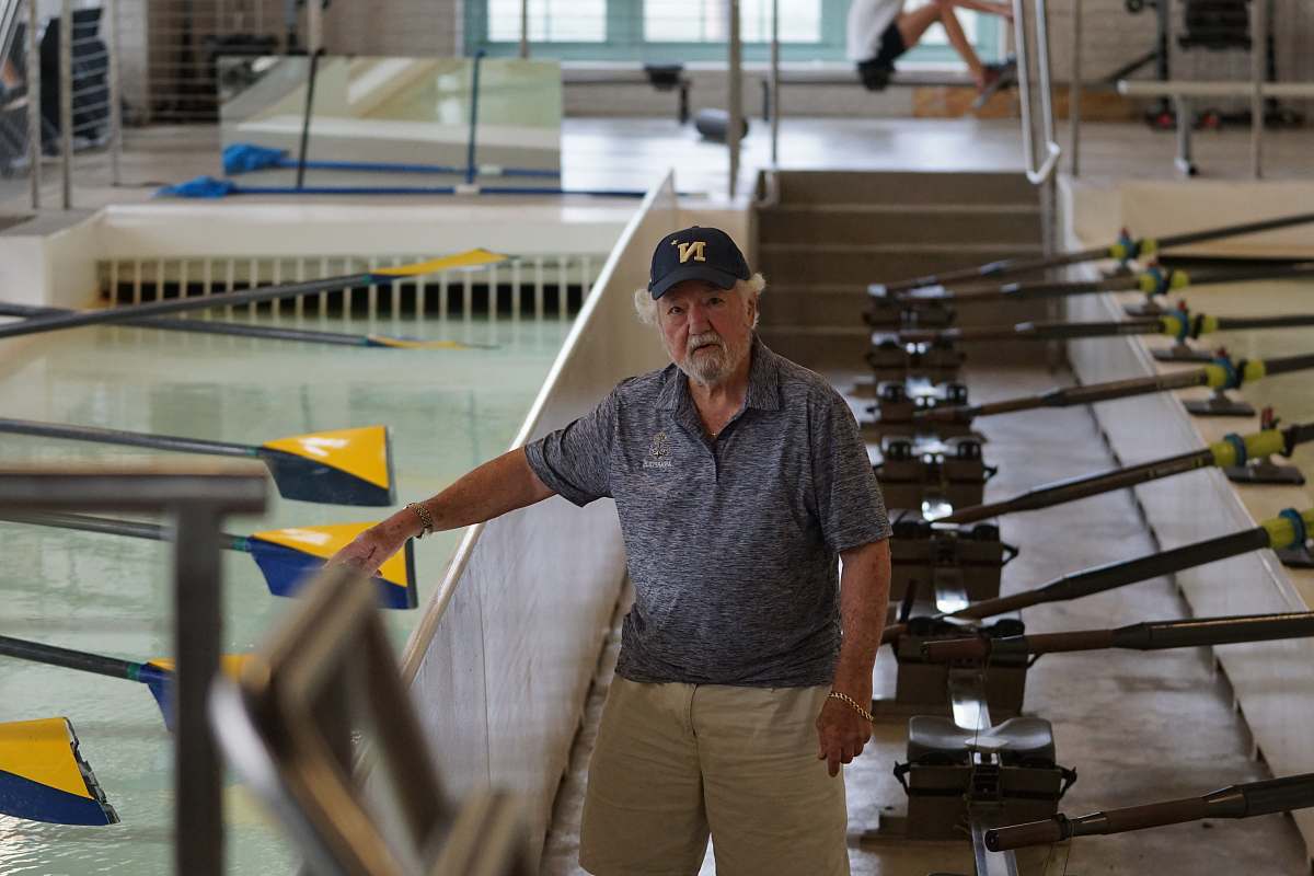 people man standing between paddles person