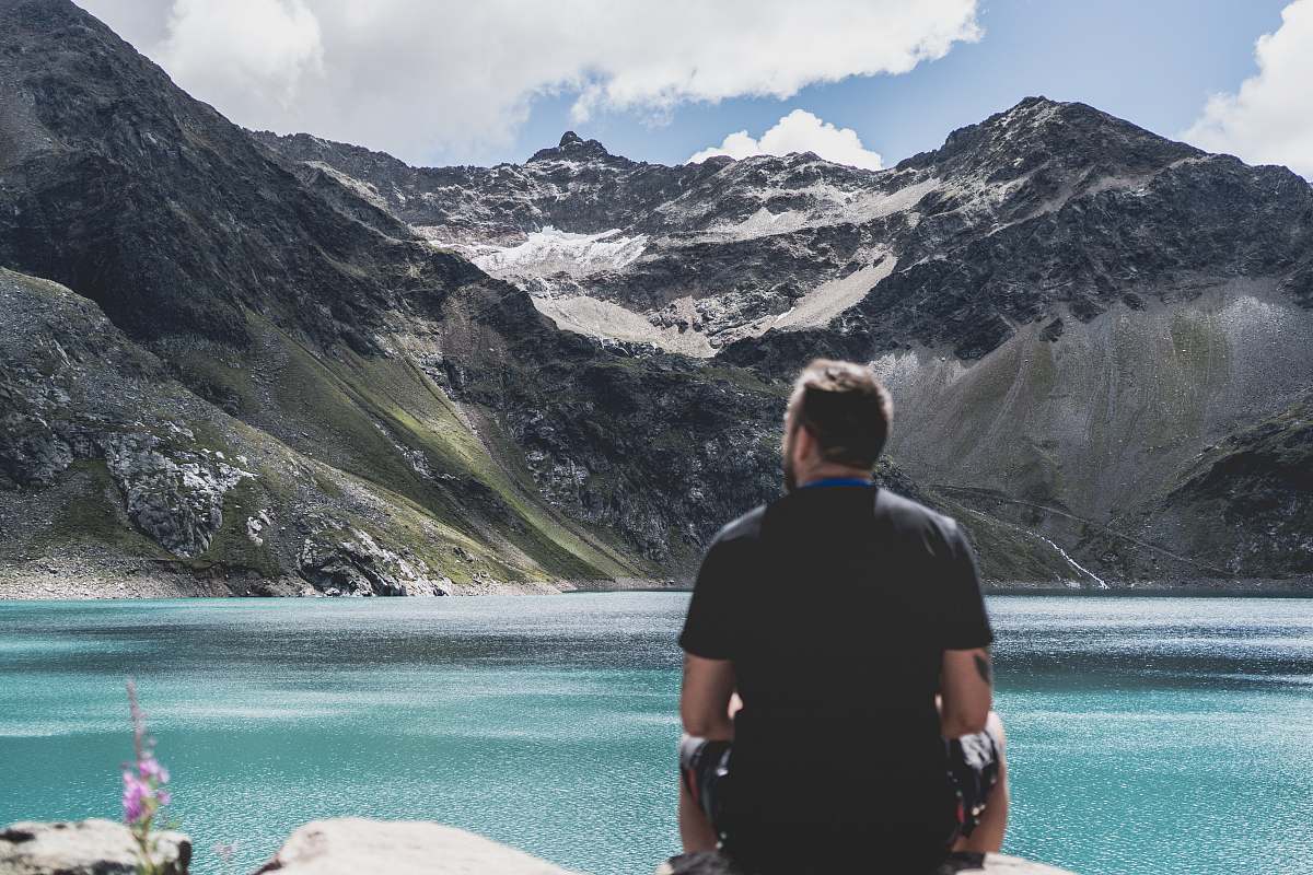 people man standing in front of mountain snow