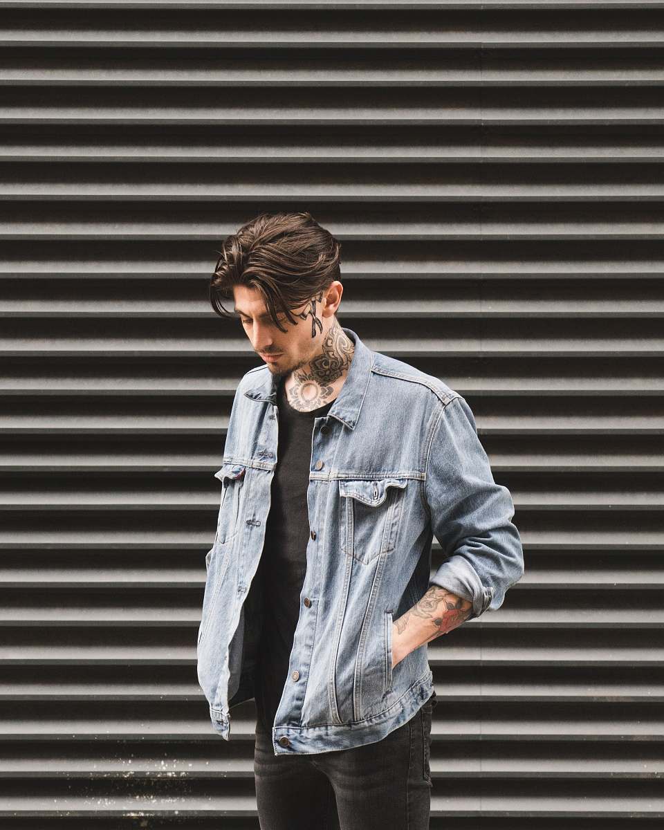 people man standing in front of roll-up door at daytime person