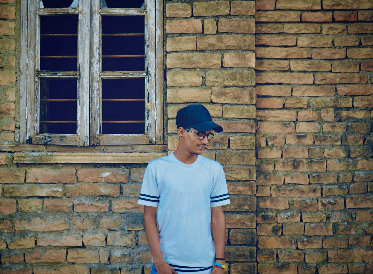person man standing in-front wall people