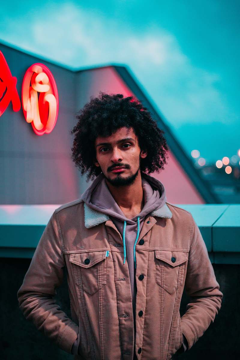 people man standing near gray building person