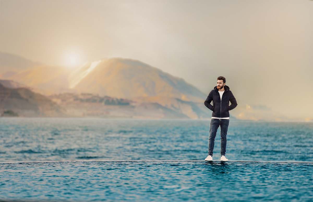 people man standing on body of water person