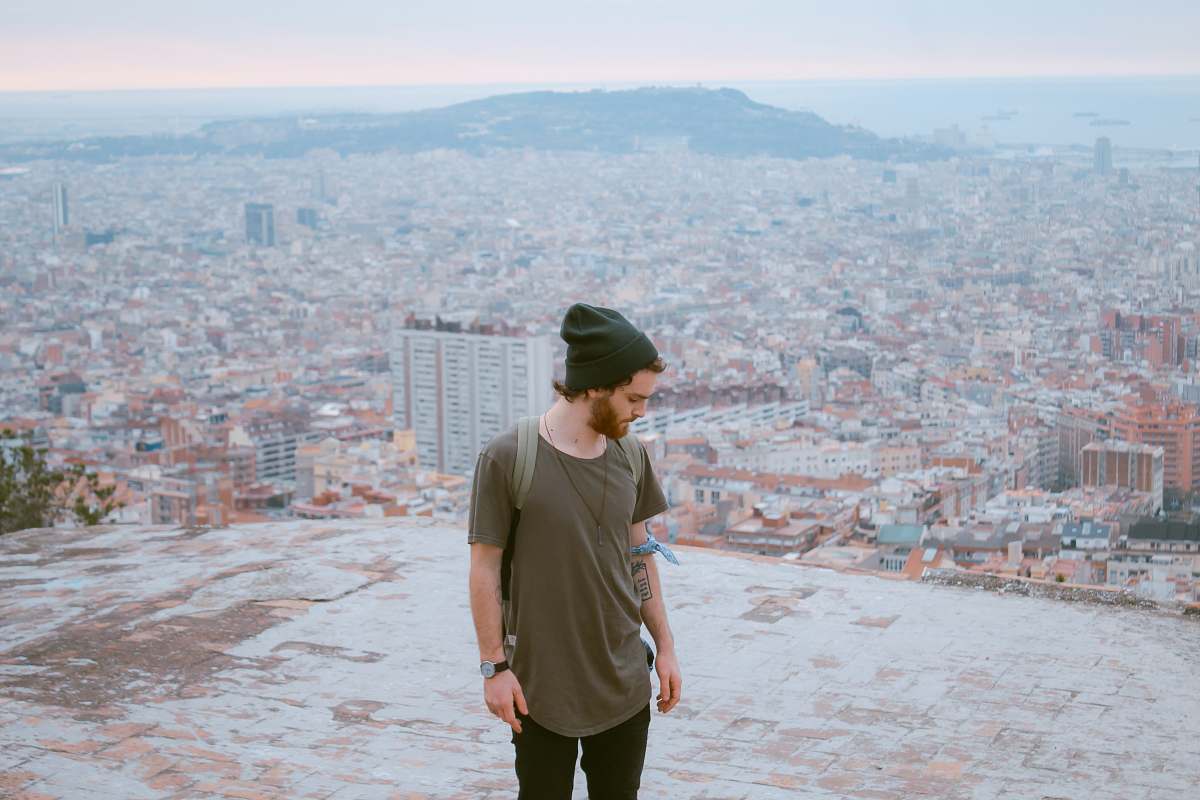 people man standing on top of building person