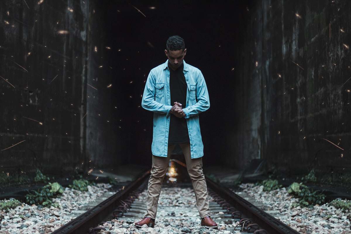 people man standing on train track person