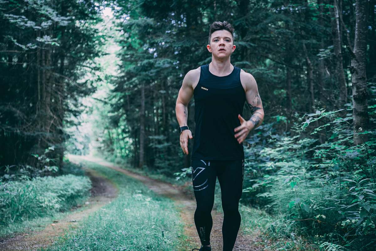 person man walking on forest trail people