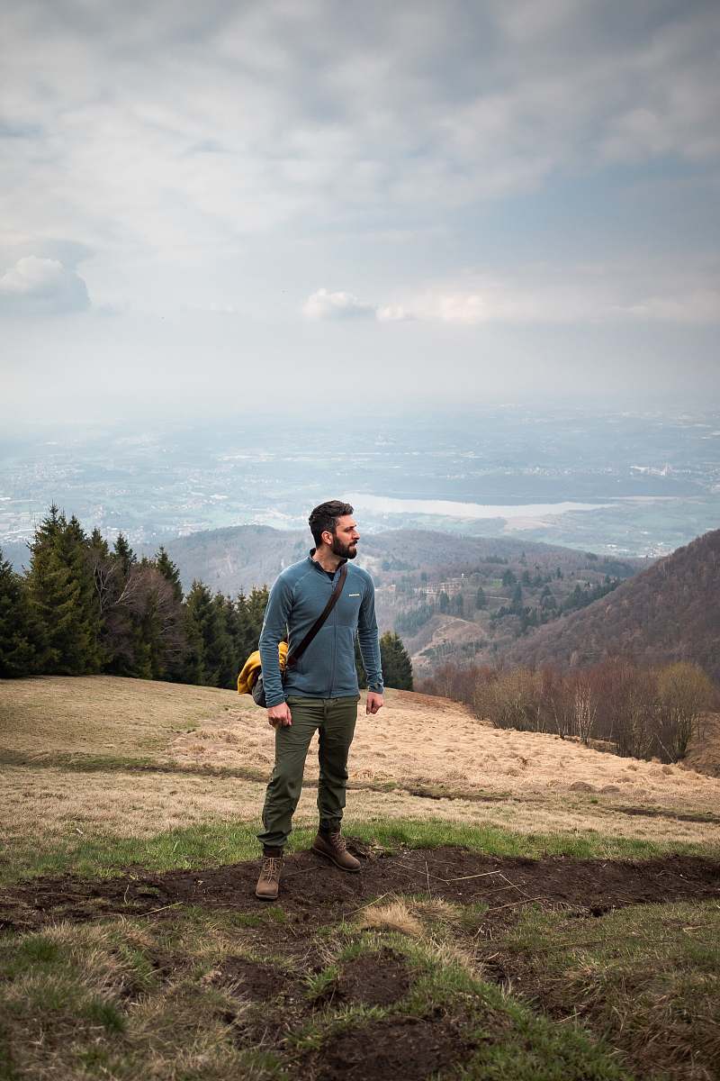 people man walking on mountain carrying bag person