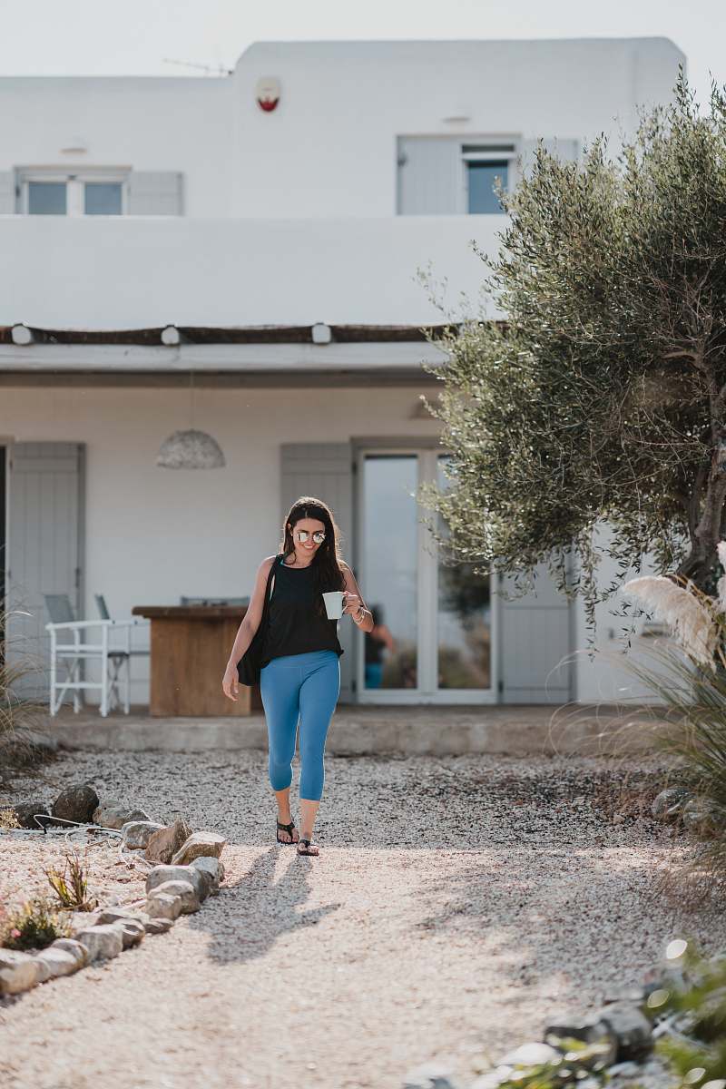 people man walking while holding mug person