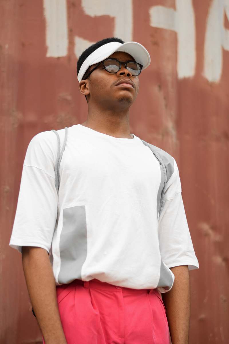 people man wearing sunvisor cap and white shirt person