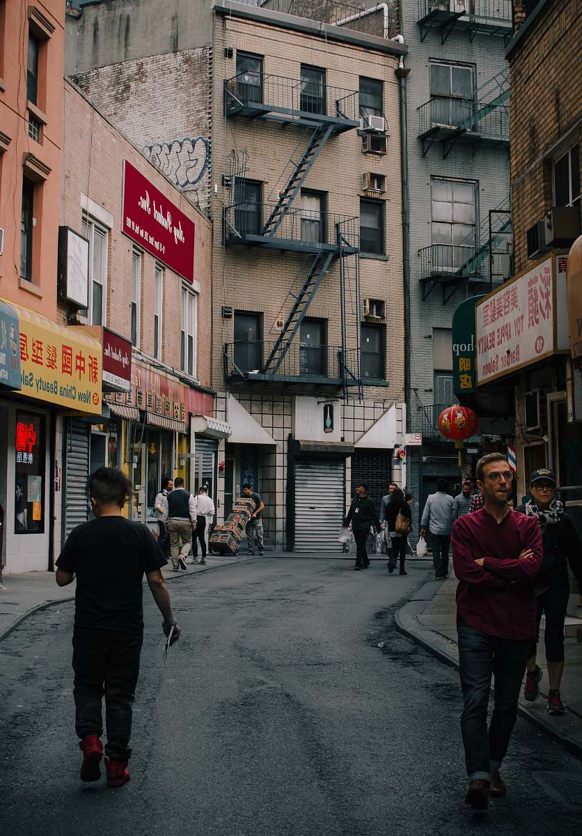 people people walking down the street at China person