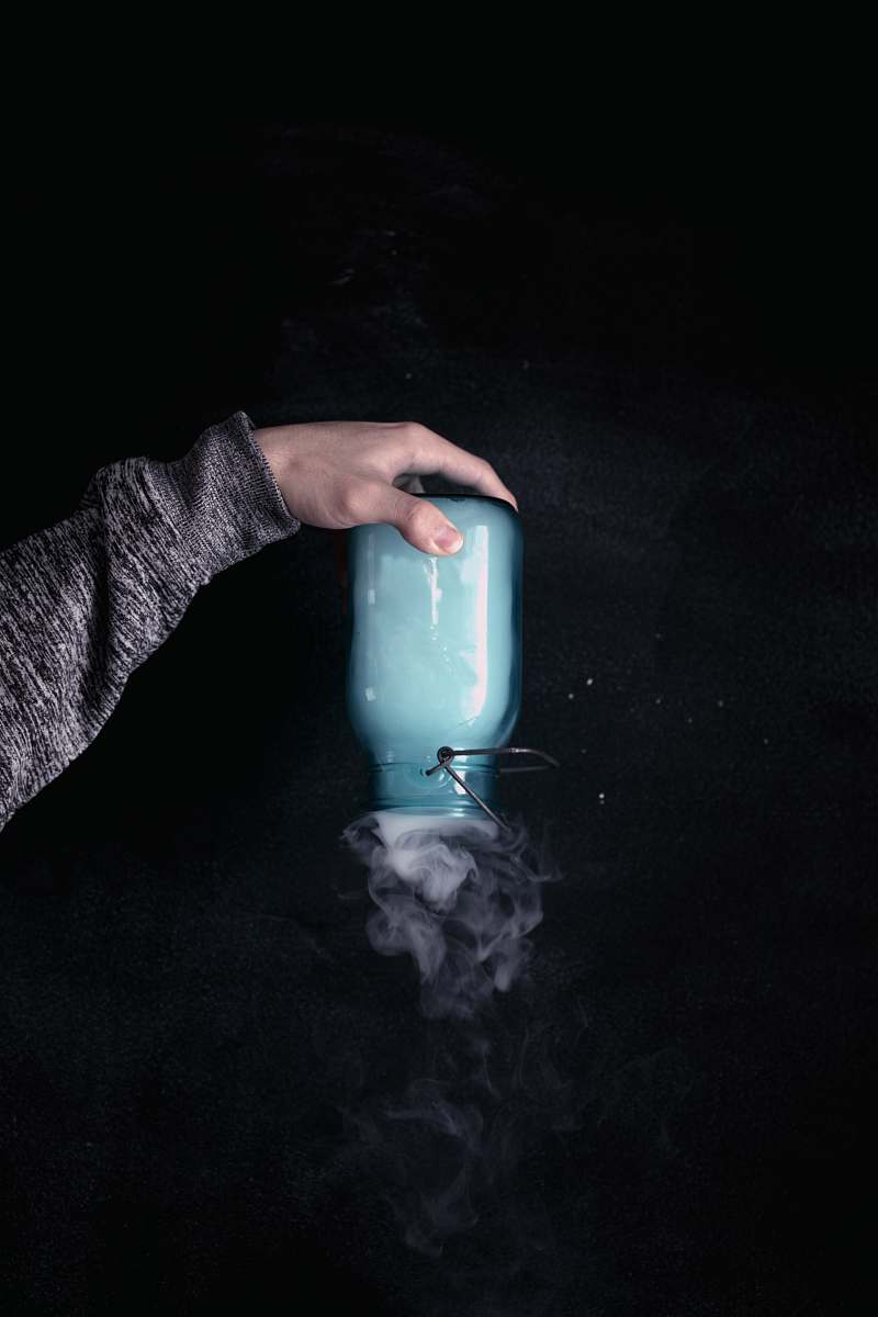 people person holding clear glass jar person