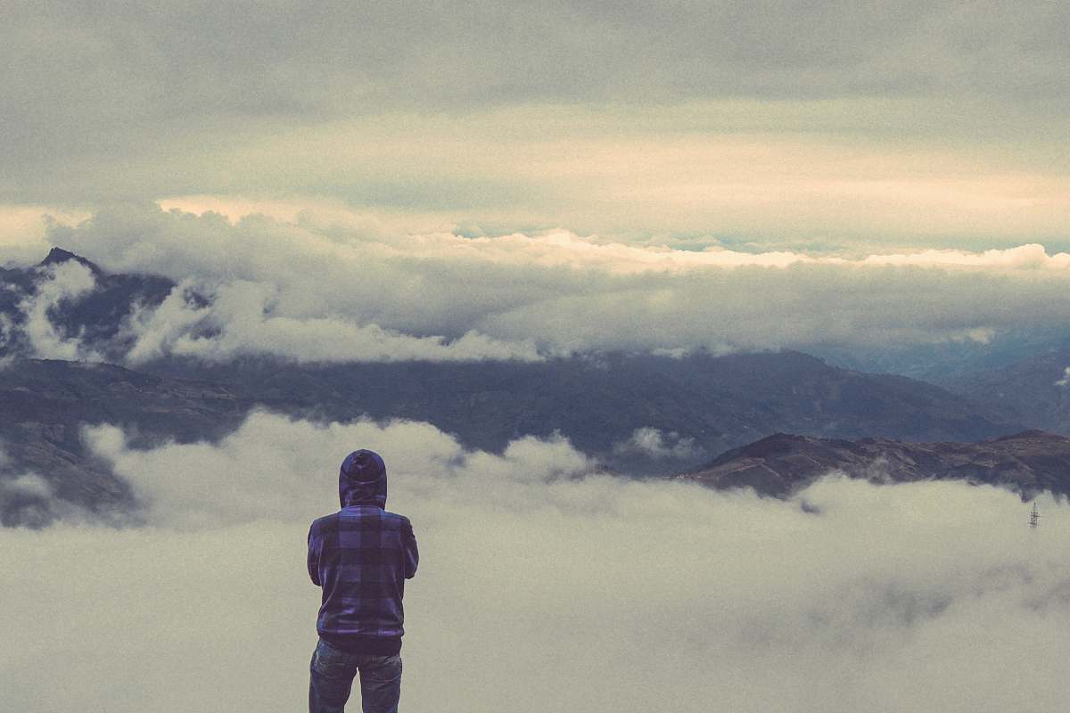 people person looking at sea of clouds during daytime person