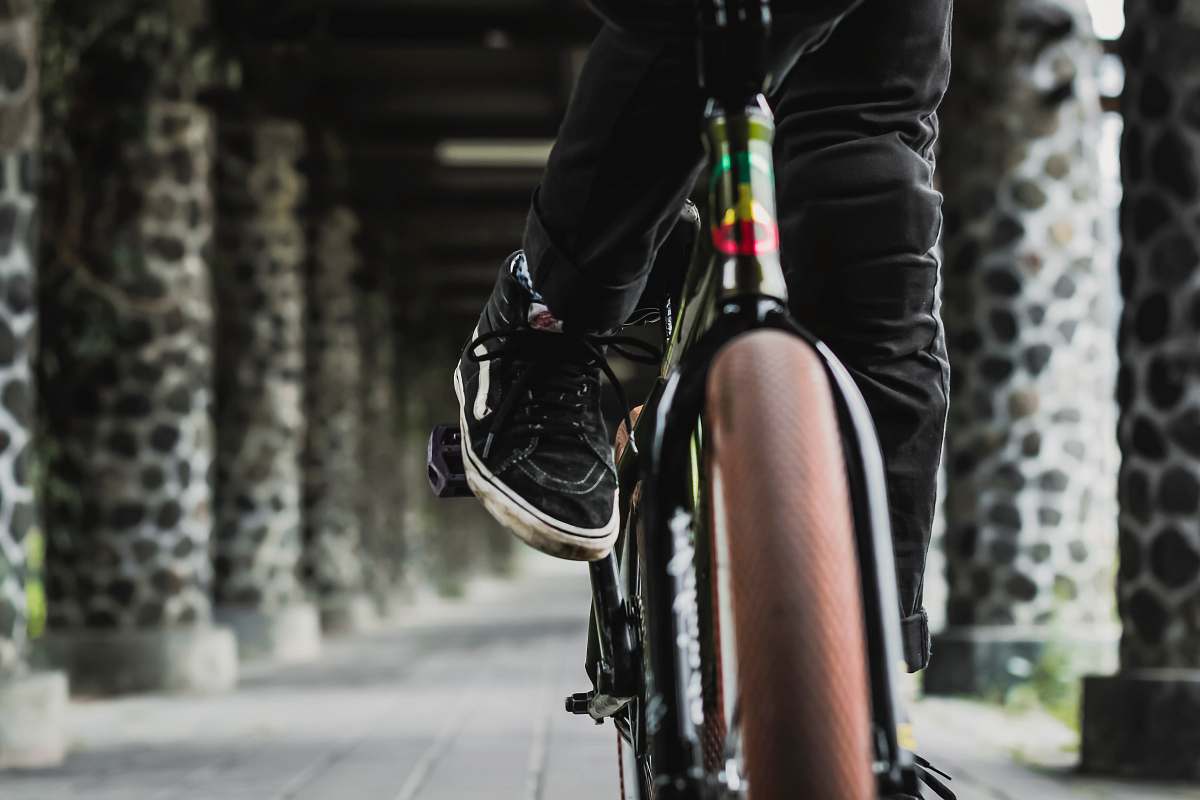 people person riding bicycle on hallway person