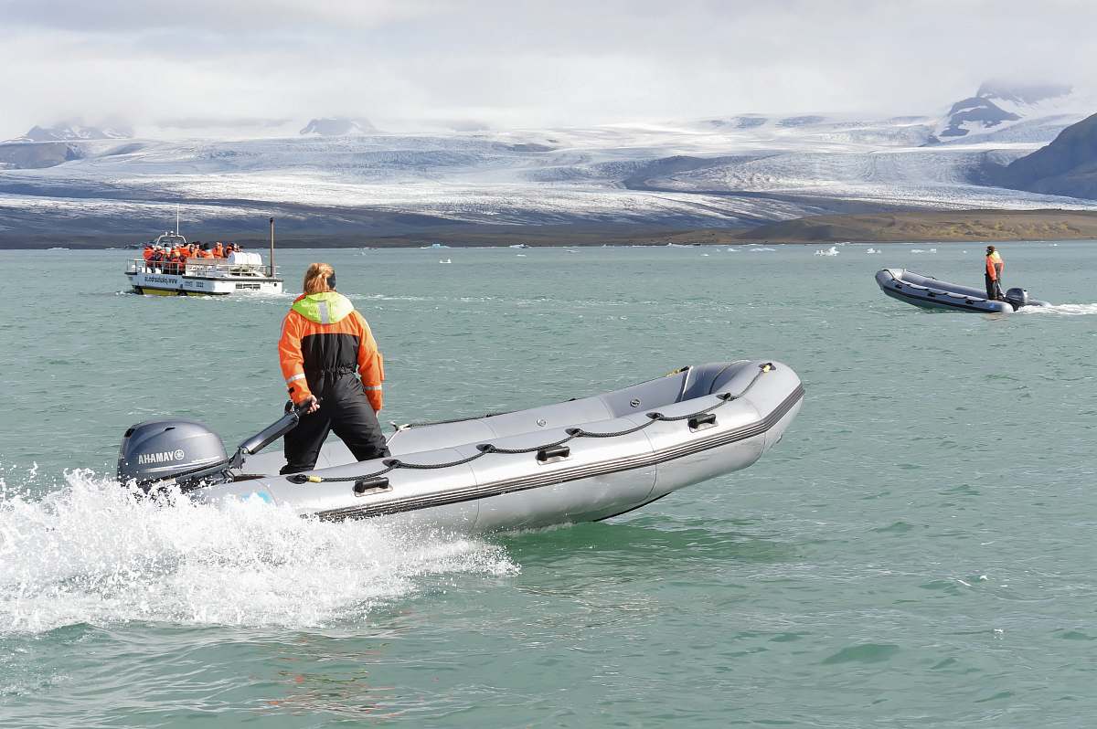 people person riding on lifeboat boat