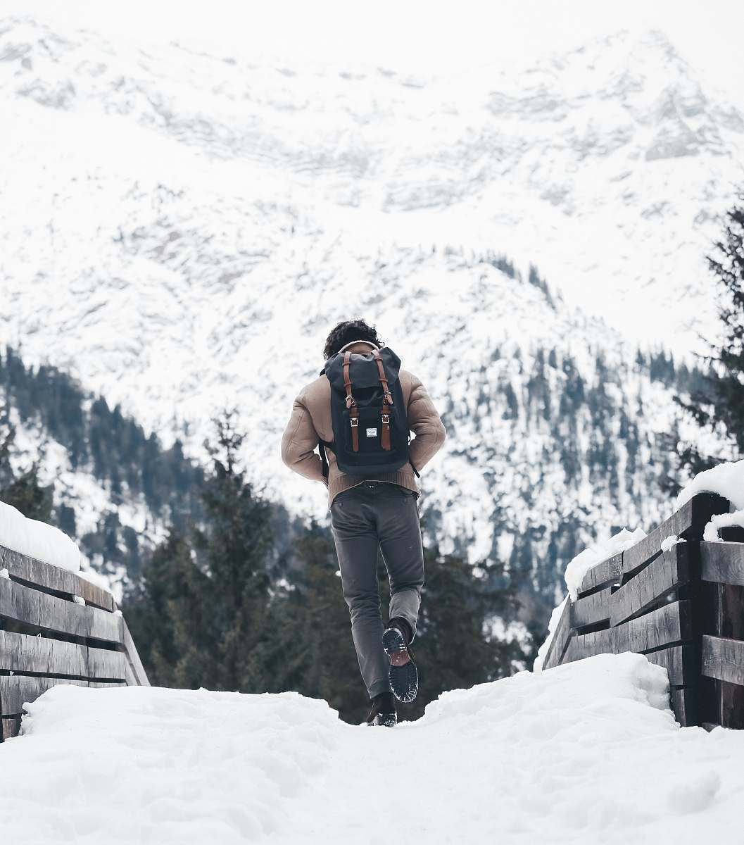 people person walking on snowy road person