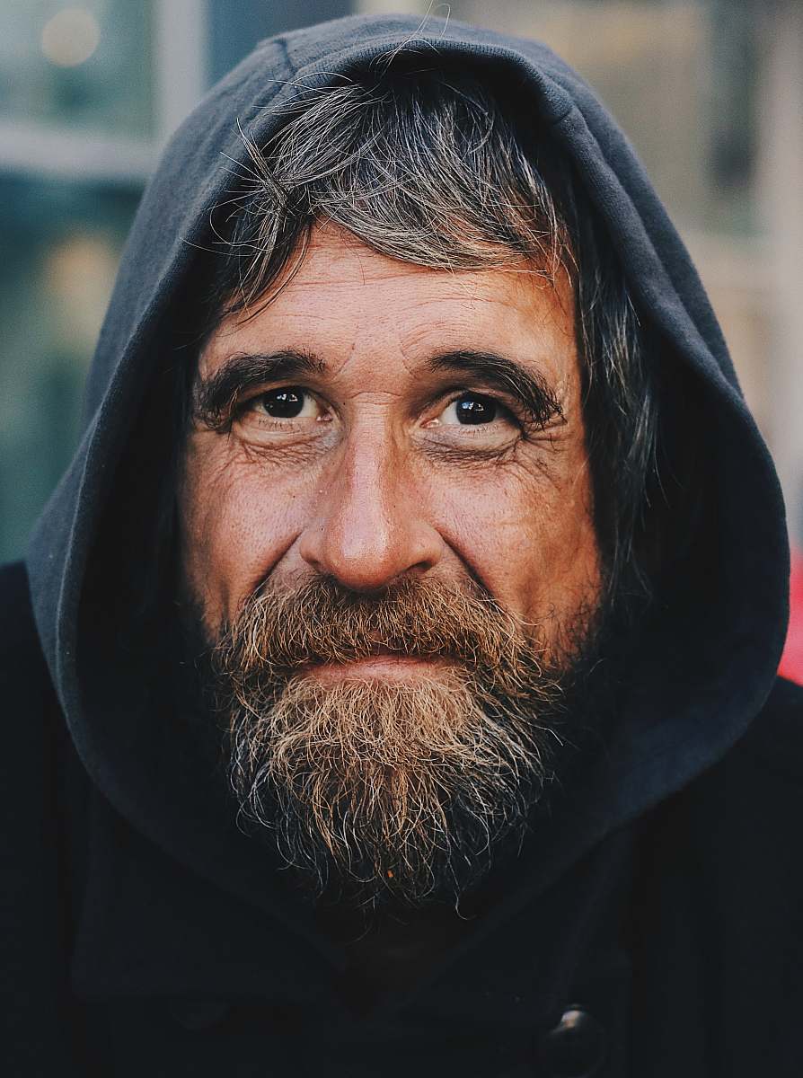 people portrait photo of a man wearing hoodie person