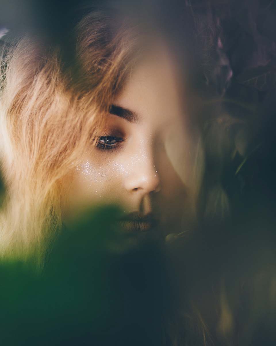 person portrait photography of woman near leaves people