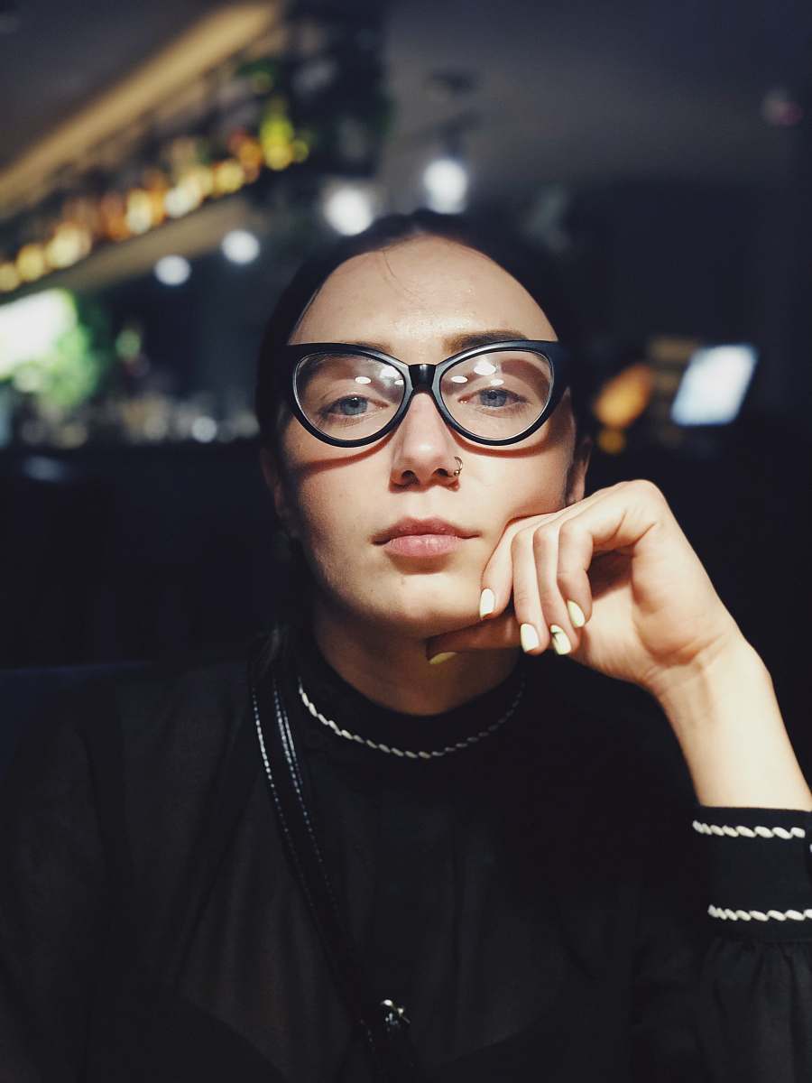 people selective focus photography of woman wearing black eyeglasses glasses