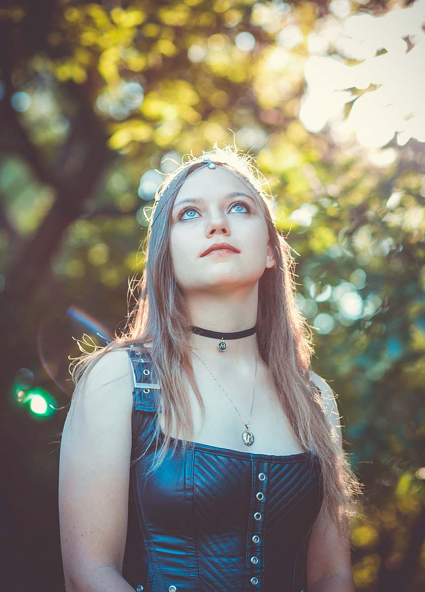 people shallow focus photography of woman in black leather sleeveless top person