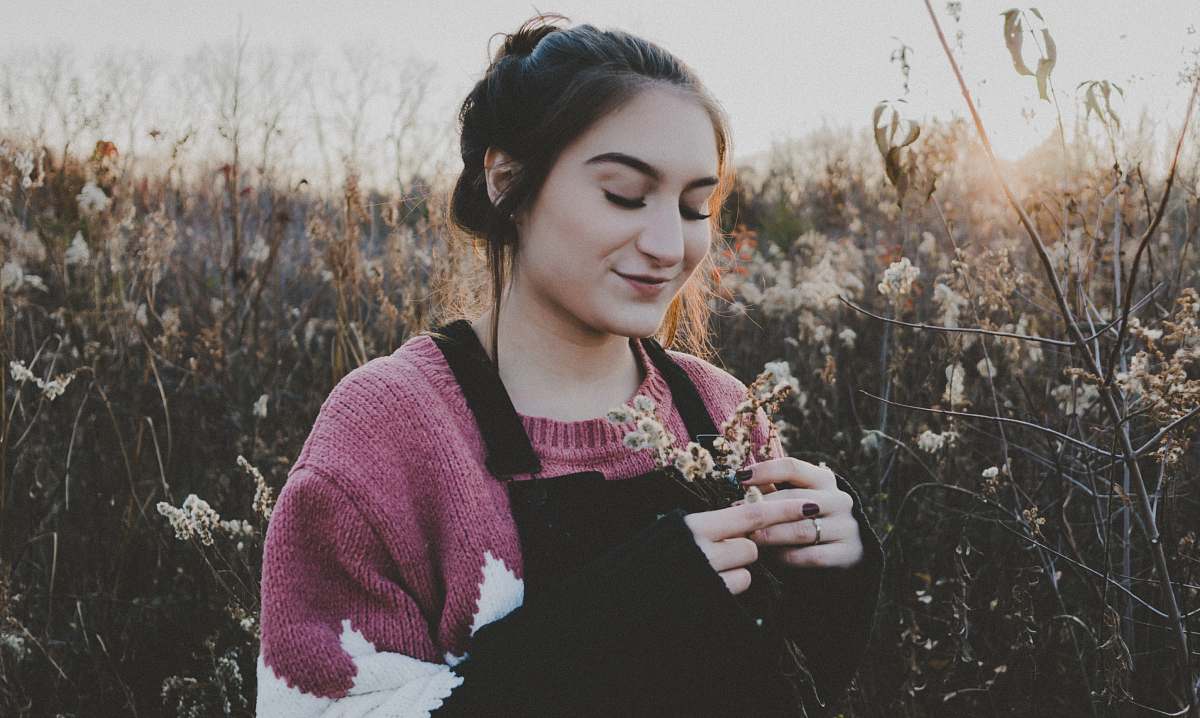 people smiling woman holding flowers person