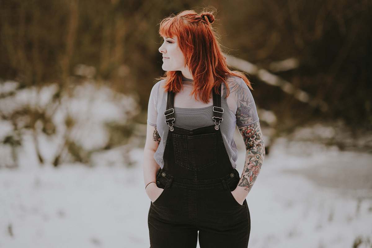 people standing woman with hand on pocket person