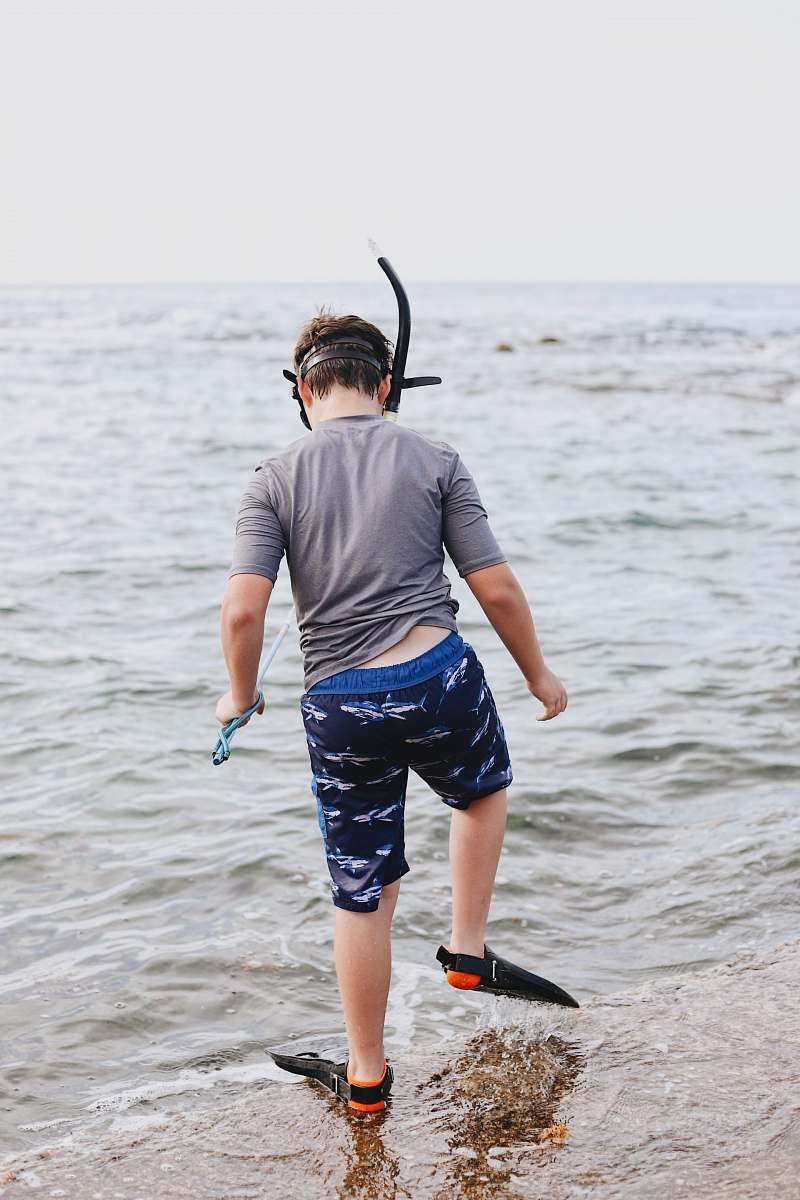 people toddler standing outdoors near body of water person