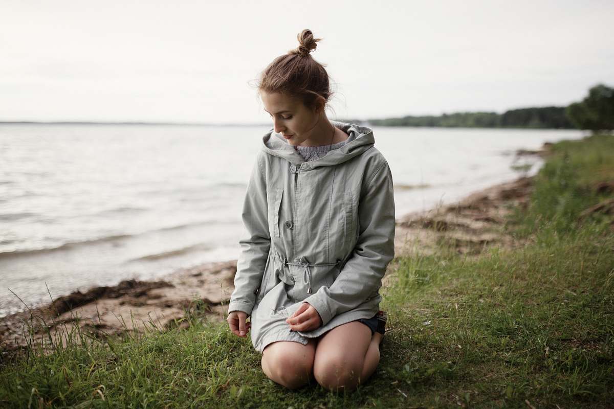 people woman beside body of water person