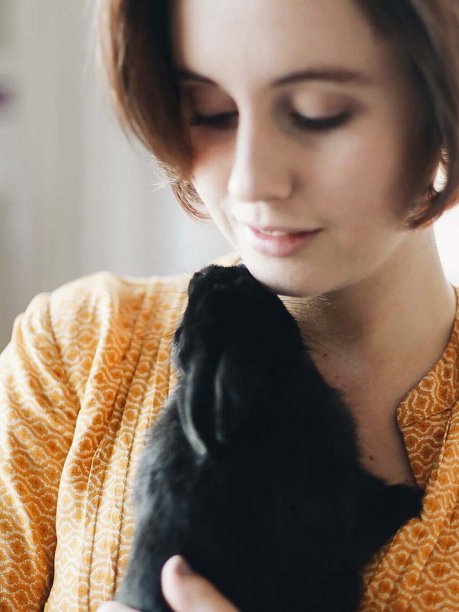 people woman carrying black dog person