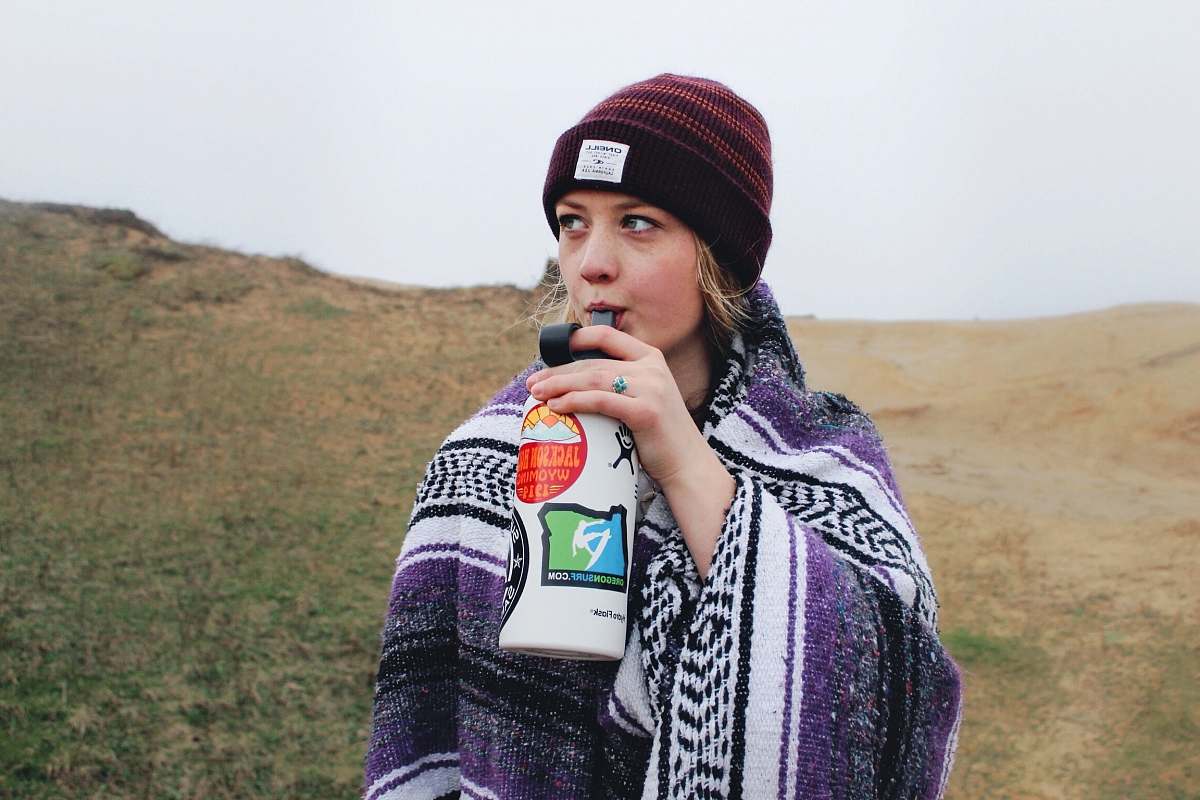 people woman drinking on white bottle person