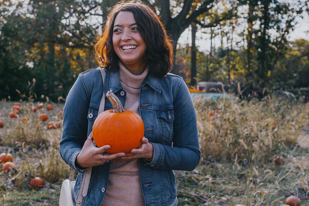 people woman holding pumpkin person