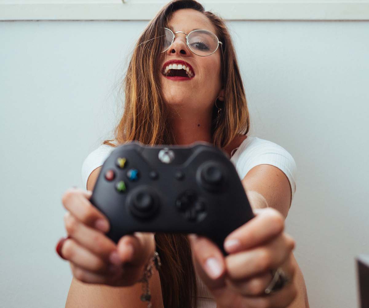 people woman holding Xbox One controller person