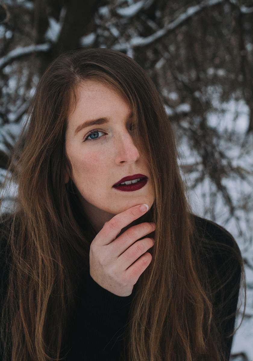 people woman in black long-sleeved dress and red lipstick person