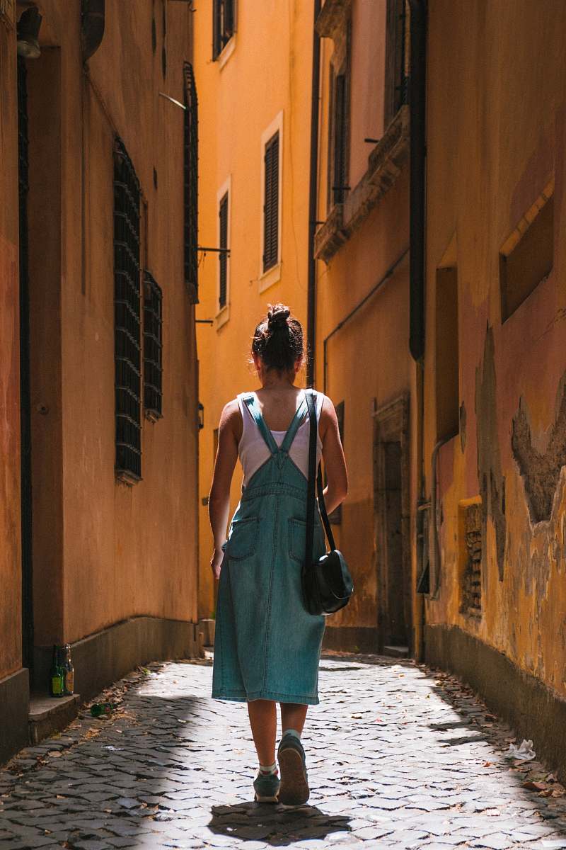 people woman in dress walking on alley person
