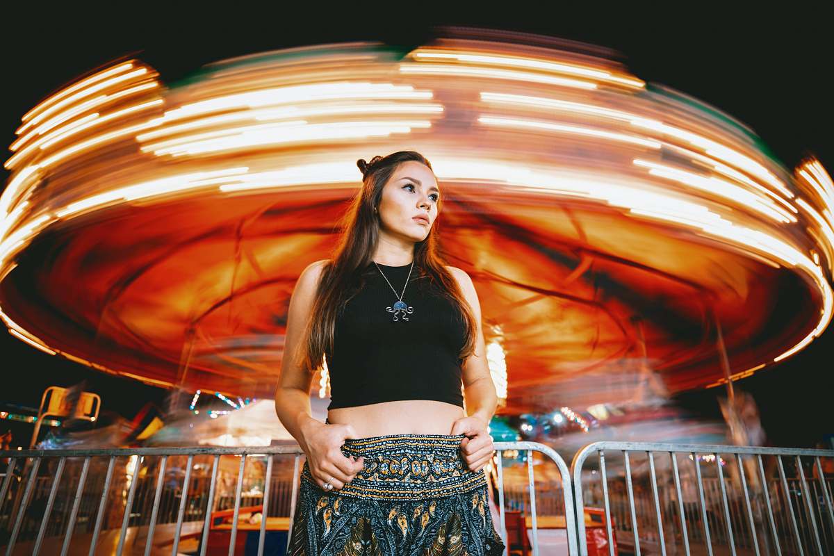 people woman in front-of carousel person