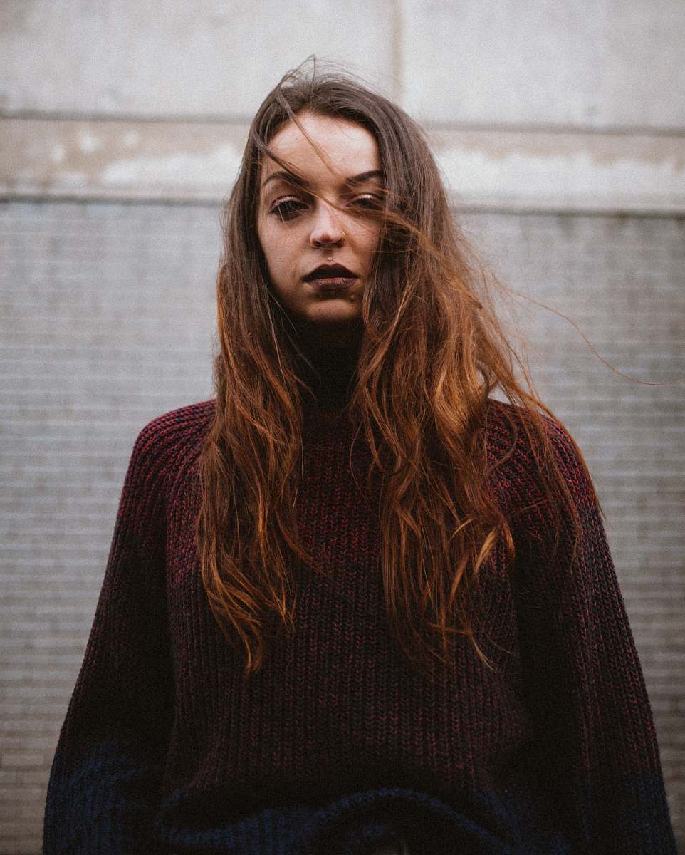 people woman in red corduroy long-sleeved top person