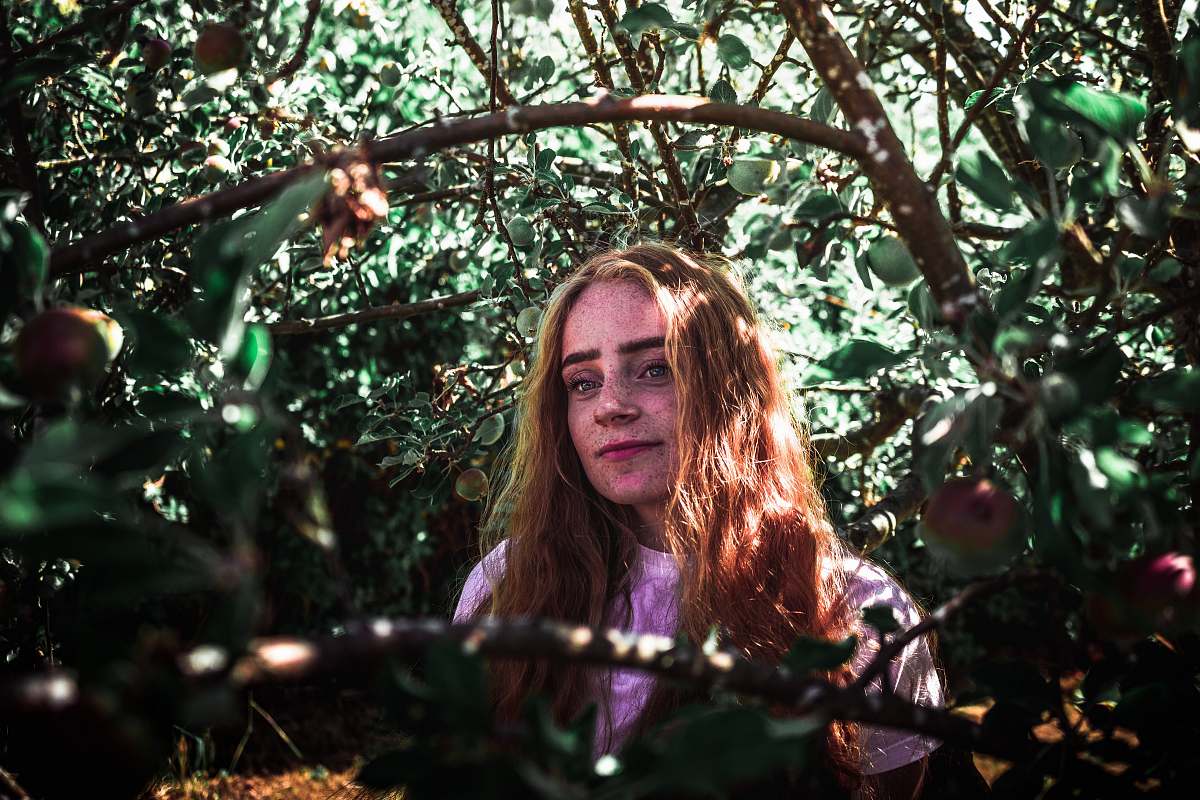 person woman in the middle of plants people