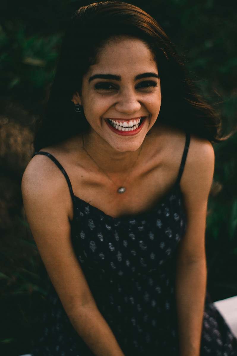 people woman sitting and smiling person