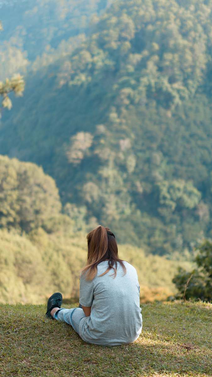 people woman sitting on grass person