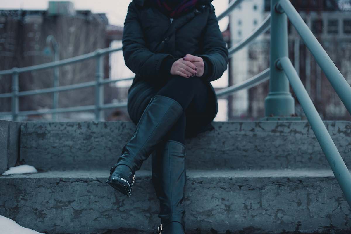 people woman sitting on gray concrete stair person