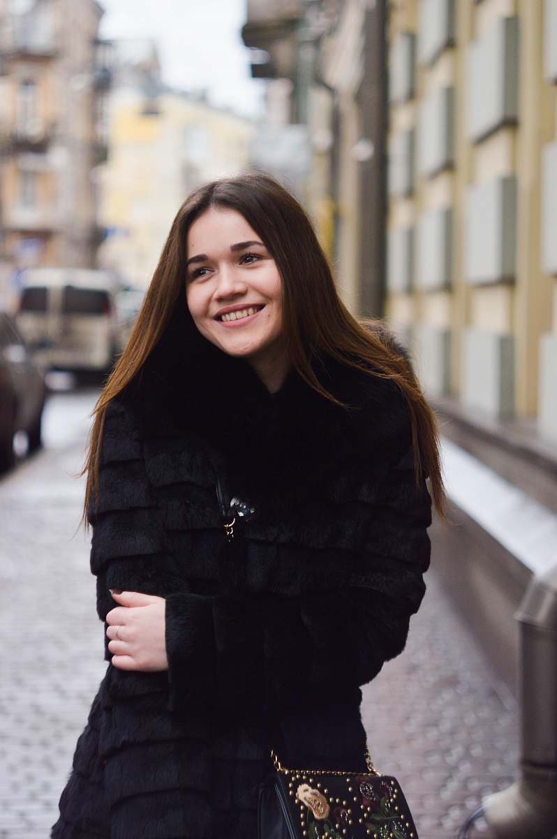 people woman smiling while talking a picture during daytime person